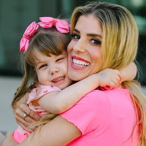 Rebecca Zamolo hugging her daughter